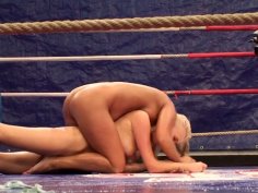 Two naked blonde chicks wrestle all naked on the ring